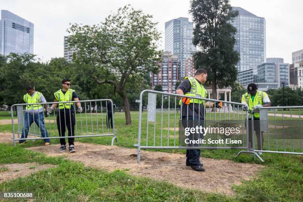 Workers set up barricades on the Boston Common where a "Free Speech" rally is scheduled and a large rally against hate In solidarity with victims of...