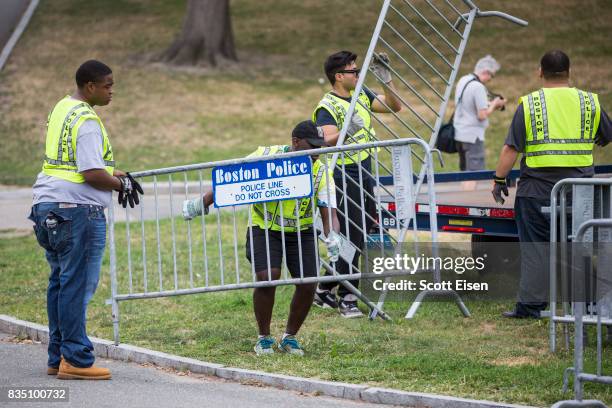 Workers set up barricades on the Boston Common where a "Free Speech" rally is scheduled and a large rally against hate In solidarity with victims of...