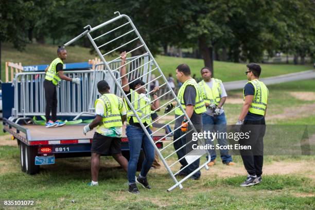 Workers set up barricades on the Boston Common where a "Free Speech" rally is scheduled and a large rally against hate In solidarity with victims of...