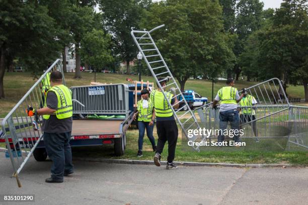 Workers set up barricades on the Boston Common where a "Free Speech" rally is scheduled and a large rally against hate In solidarity with victims of...