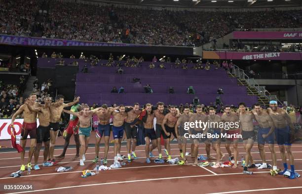 16th IAAF World Championships: View of 17 athletes victoriously flexing topless after Men's Decathlon competition at Olympic Stadium. Goofy. London,...