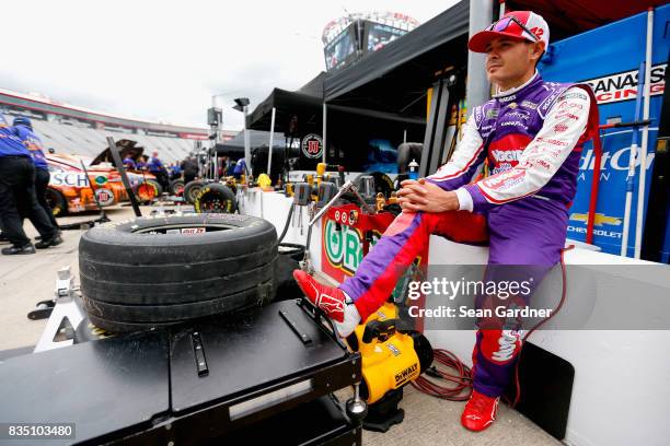 Kyle Larson, driver of the Huggies Little Movers Chevrolet, sits by his car during practice for the Monster Energy NASCAR Cup Series Bass Pro Shops...