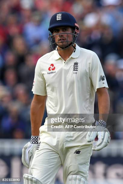 England's Alastair Cook leaves the field after losing his wicket for 243 during play on day 2 of the first Test cricket match between England and the...