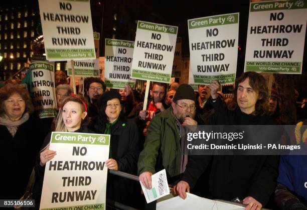 Protesters demonstrate outside Downing Street in Westminster, London, against government plans to build a third runway at Heathrow Airport.