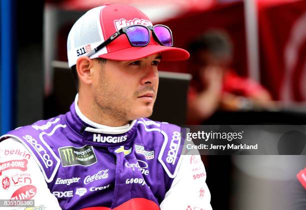 Kyle Larson, driver of the Huggies Little Movers Chevrolet, sits by his car during practice for the Monster Energy NASCAR Cup Series Bass Pro Shops...