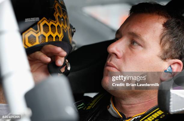 Ryan Newman, driver of the Caterpillar Chevrolet, sits in his car during practice for the Monster Energy NASCAR Cup Series Bass Pro Shops NRA Night...