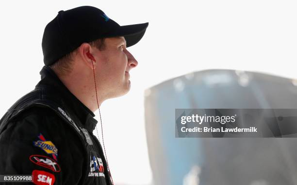 Michael McDowell, driver of the Wipes.com Chevrolet, stands by his car during practice for the Monster Energy NASCAR Cup Series Bass Pro Shops NRA...