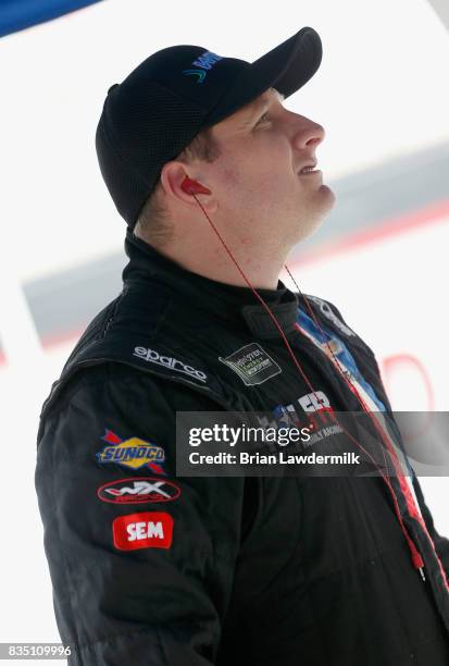 Michael McDowell, driver of the Wipes.com Chevrolet, stands by his car during practice for the Monster Energy NASCAR Cup Series Bass Pro Shops NRA...