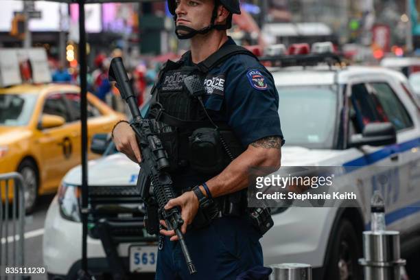 Members of the New York City Police Counterterrorism force stand guard in Times Square on August 18, 2017 in New York City. The NYPD has increased...