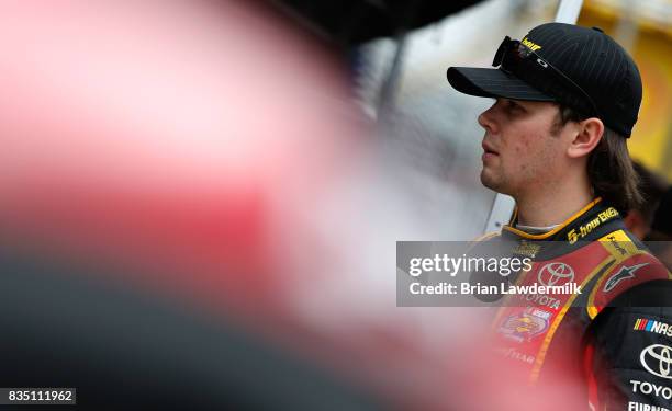 Erik Jones, driver of the 5-hour ENERGY Extra Strength Toyota, stands by his car during practice for the Monster Energy NASCAR Cup Series Bass Pro...