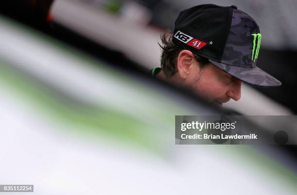 Kurt Busch, driver of the Monster Energy/Haas Automation Ford, stands by his car during practice for the Monster Energy NASCAR Cup Series Bass Pro...