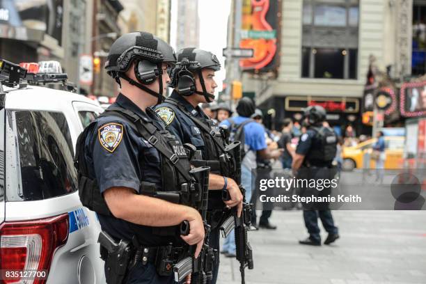 Members of the New York City Police Counterterrorism force stand guard in Times Square on August 18, 2017 in New York City. The NYPD has increased...