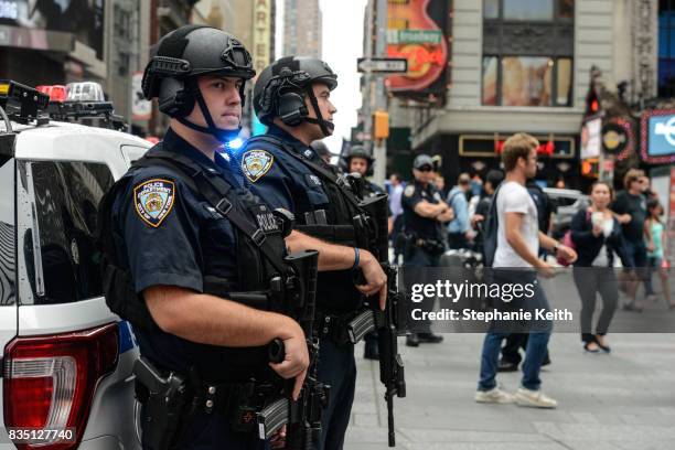 Members of the New York City Police Counterterrorism force stand guard in Times Square on August 18, 2017 in New York City. The NYPD has increased...