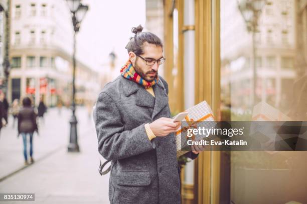 outdoors portrait of a young man - christmas atmosphere in budapest stock pictures, royalty-free photos & images