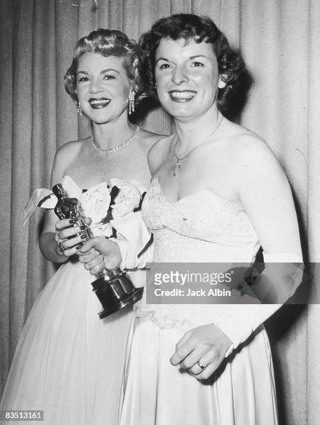 American actor Claire Trevor presents the Best Supporting Actress award to American actor Mercedes McCambridge at the Academy Awards, Hollywood,...