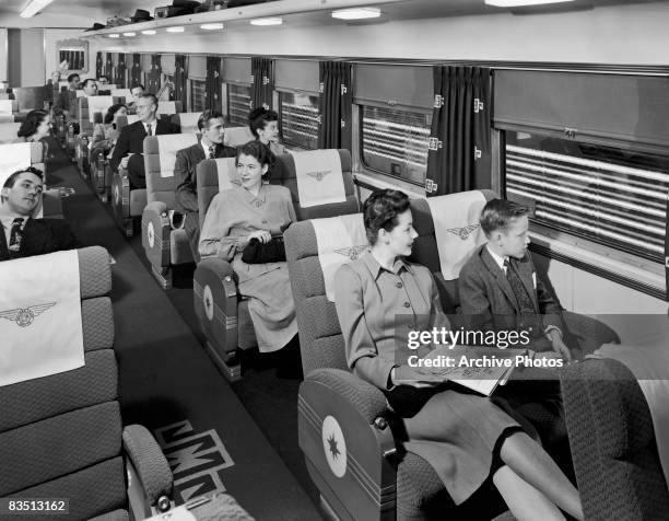 Passengers in reclining seats aboard the Rock Island Line's Rocky Mountain Rocket passenger train, 1940s.