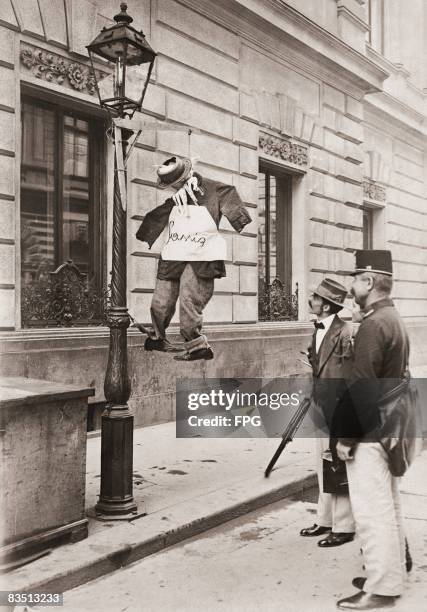 An effigy of Prime Minister of Yugoslavia Nikola Pasic , hanging from a lampost in Budapest, Hungary, circa 1921.
