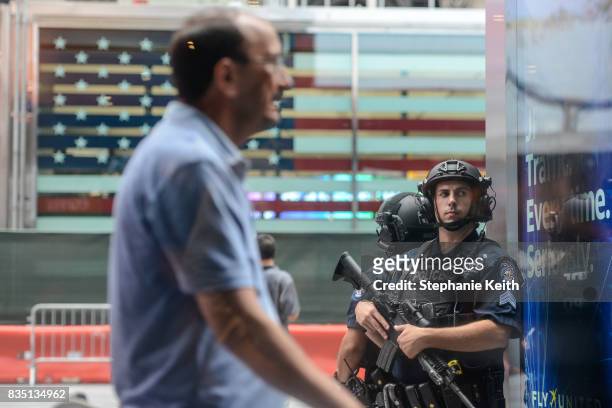 Members of the New York City Police Counterterrorism force stand guard in Times Square on August 18, 2017 in New York City. The NYPD has increased...