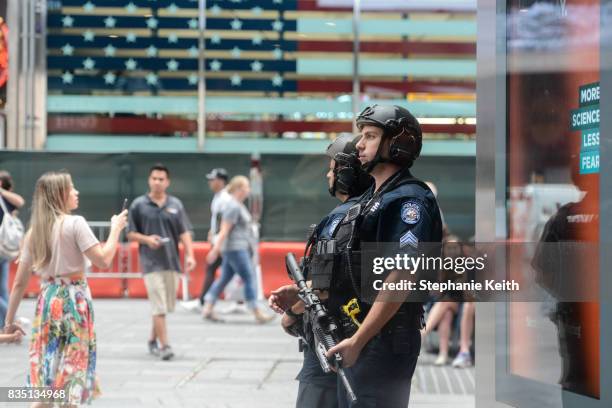 Members of the New York City Police Counterterrorism force stand guard in Times Square on August 18, 2017 in New York City. The NYPD has increased...