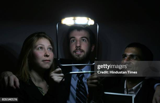 Contenders Maran Louise Somers, Patrick Walsh and Vikash Kumar with their solar powered light that is affordable for villagers across India.