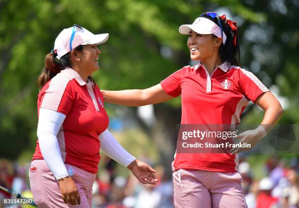 Lizette Salas and Danielle Kang of Team USA celebrate winning their match during the morning foursomes matches of The Solheim Cup at Des Moines Golf...