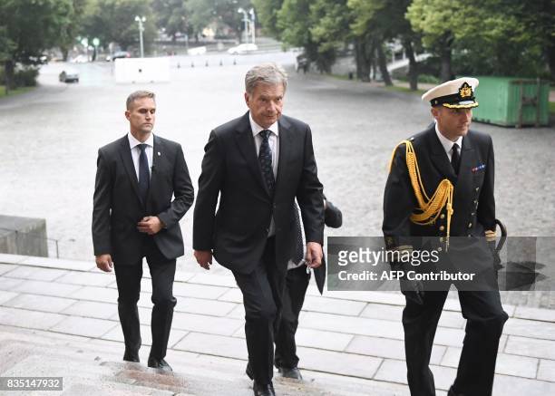 President of Finland Sauli Niinisto arrives for the prayer service at the Turku Cathedral for the victims of Friday's stabbings in Turku, Finland...