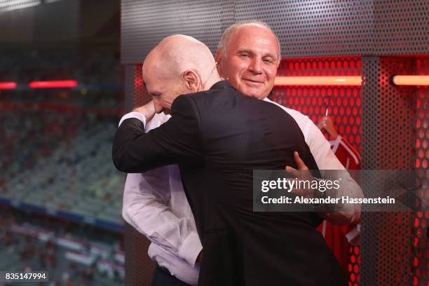 Uli Hoeness , President of FC Bayern Muenchen reacts with Matthias Sammer at the Eurosport TV studio prior to the Bundesliga match between FC Bayern...