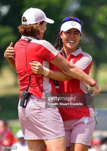 Danielle Kang of Team USA celebrates with Team USA Captain Juli Inkster after winning her match during the morning foursomes matches of The Solheim...