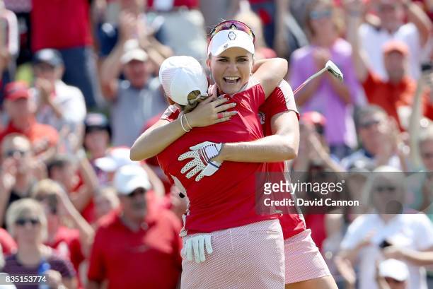 Cristie Kerr and Lexi Thompson of the United States Team Team celebrate after securing a half point on the 18th hole in their match against Charley...