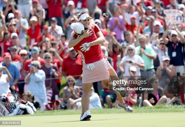 Cristie Kerr and Lexi Thompson of the United States Team Team celebrate after securing a half point on the 18th hole in their match against Charley...