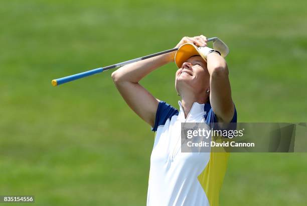 Catriona Matthew of Scotland and the European Team reacts to almost holing her second shot from a difficult position in a bunker on the 17th hole in...