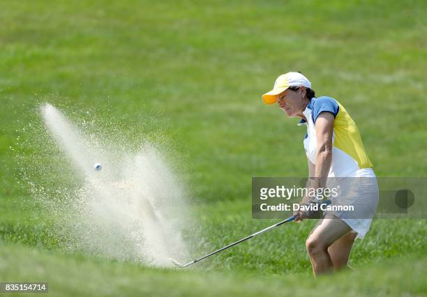 Catriona Matthew of Scotland and the European Team plays her second shot from a difficult position in a bunker on the 17th hole in her match with...