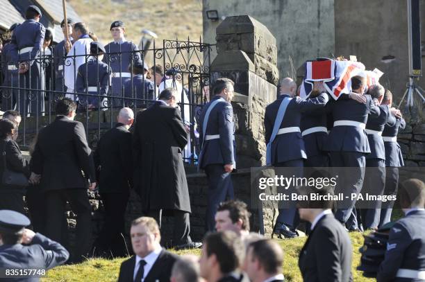 Personnel carry the flag-draped coffin of air cadet Katie-Jo Davies at her funeral at St Barnabas Church, High Street, Gilfach Goch in South Wales.