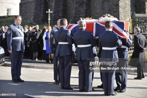 Personnel carry the flag-draped coffin of air cadet Katie-Jo Davies at her funeral at St Barnabas Church, High Street, Gilfach Goch in South Wales.
