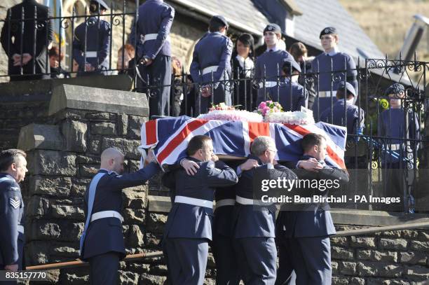 Personnel carry the flag-draped coffin of air cadet Katie-Jo Davies at her funeral at St Barnabas Church, High Street, Gilfach Goch in South Wales.