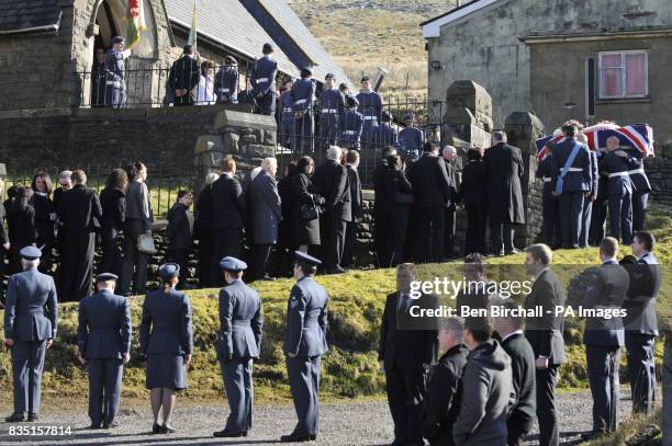 Personnel carry the flag-draped coffin of air cadet Katie-Jo Davies at her funeral at St Barnabas Church, High Street, Gilfach Goch in South Wales.