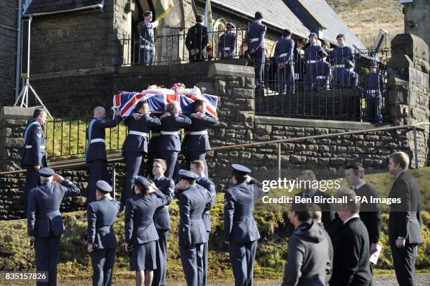 Personnel carry the flag-draped coffin of air cadet Katie-Jo Davies at her funeral at St Barnabas Church, High Street, Gilfach Goch in South Wales.