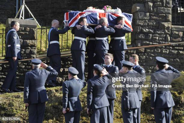 Personnel carry the flag-draped coffin of air cadet Katie-Jo Davies at her funeral at St Barnabas Church, High Street, Gilfach Goch in South Wales.