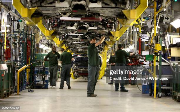 General view of workers on the Jaguar XF production line in Castle Bromwich, Birmingham.