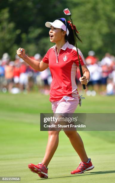 Danielle Kang of Team USA celebrates holeing the winning putt during the morning foursomes matches of The Solheim Cup at Des Moines Golf and Country...