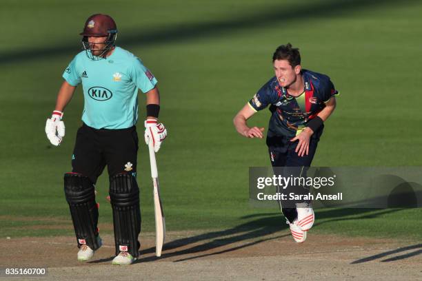 Adam Milne of Kent Spitfires bowls as Aaron Finch of Surrey backs up during the NatWest T20 Blast South Group match between Kent Spitfires and Surrey...