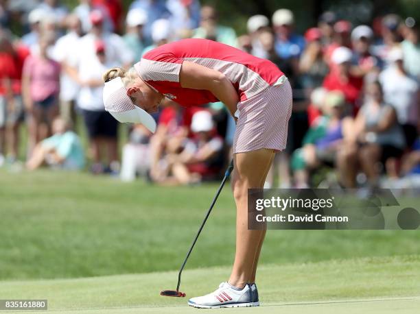 Stacy Lewis of the United States Team Team reacts to her putt on teh 18th hole in her match with Gerina Piller against Karine Icher and Catriona...