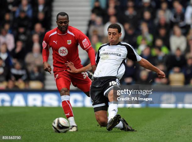 Derby County's Lewin Nyatanga tackles Bristol City's Stern John during the Coca-Cola Championship match at Pride Park, Derby.