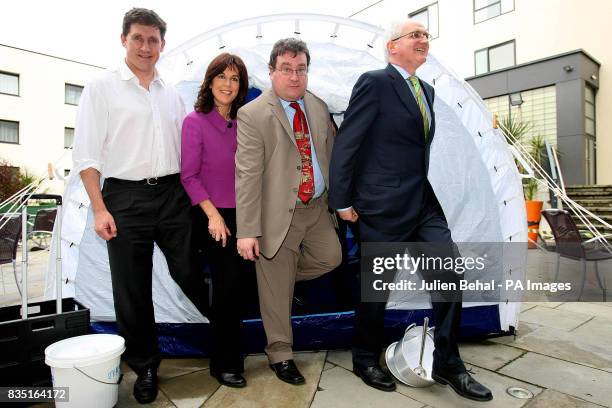 Minister Eamon Ryan, Senator Deirdre De Burca, Senator Dan Boyle and Green Party Leader John Gormley pose for a photo in the UNHCR Tent during the...