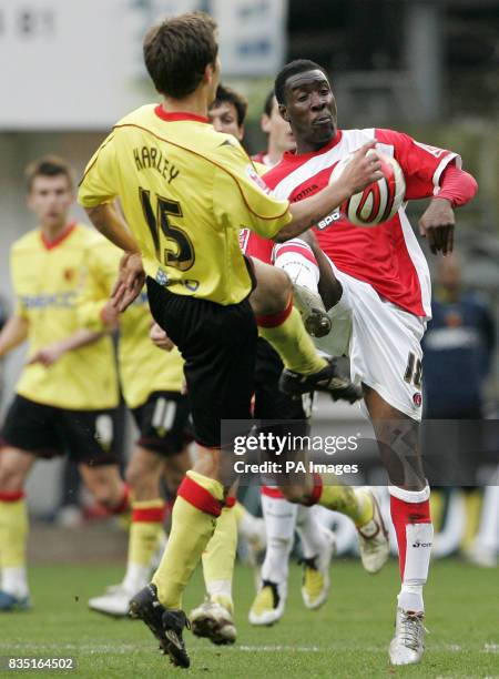 Charlton Athletic's Lloyd Sam and Watford's Jon Harley compete for the ball during the Coca-Cola Championship match at The Valley, Charlton.