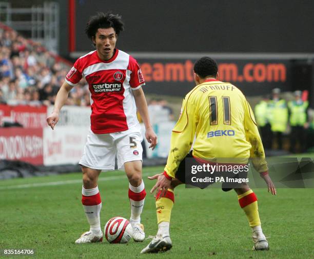 Charlton Athletic's Zheng Zhi attempts to get past Watford's Jobi McAnuff during the Coca-Cola Championship match at The Valley, Charlton.