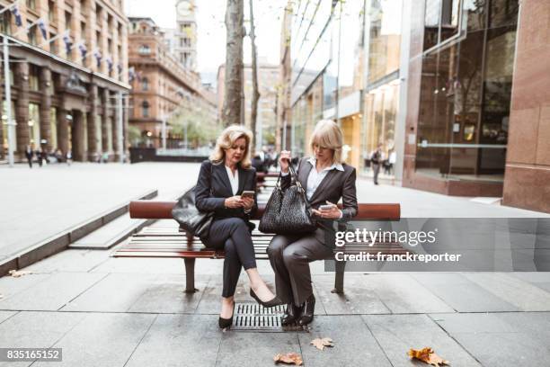 business colleagues walking on the city - 80s business women stock pictures, royalty-free photos & images