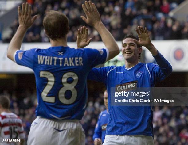 Rangers' Steven Whittaker and Kyle Lafferty celebrate after Lafferty scores during the Homecoming Scottish Cup, Quarter Final match at Ibrox, Glasgow.