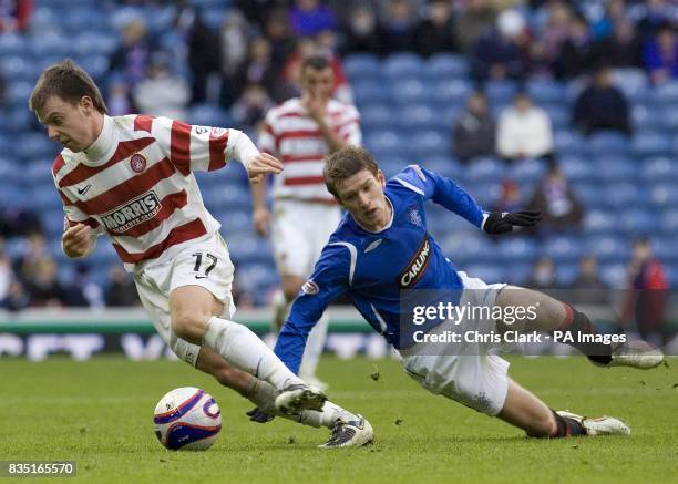 Hamilton's Paul McGowan turns away from Rangers' Steven Davis during the Homecoming Scottish Cup, Quarter Final match at Ibrox, Glasgow.