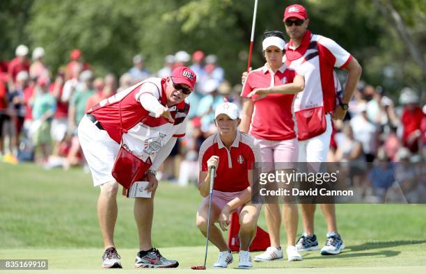 Stacy Lewis of the United States Team Team lines up her putt on the 18th hole in her match with Gerina Piller against Karine Icher and Catriona...
